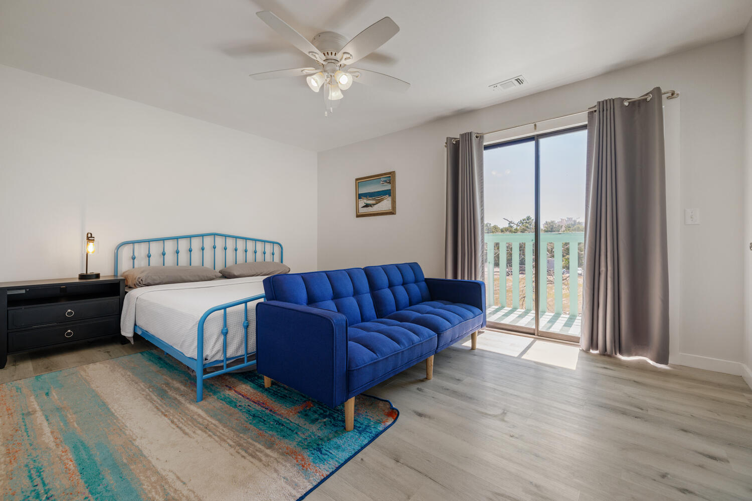 145 Cain Road Panama City Beach, FL 32413 - Photo 29 of 60 a living room with a bed furniture and a window