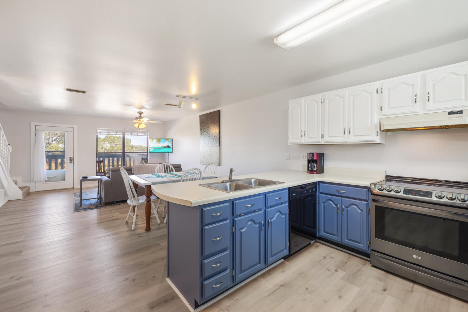 145 Cain Road Panama City Beach, FL 32413 - Photo 31 of 60 a kitchen with lots of counter top space and view of living room