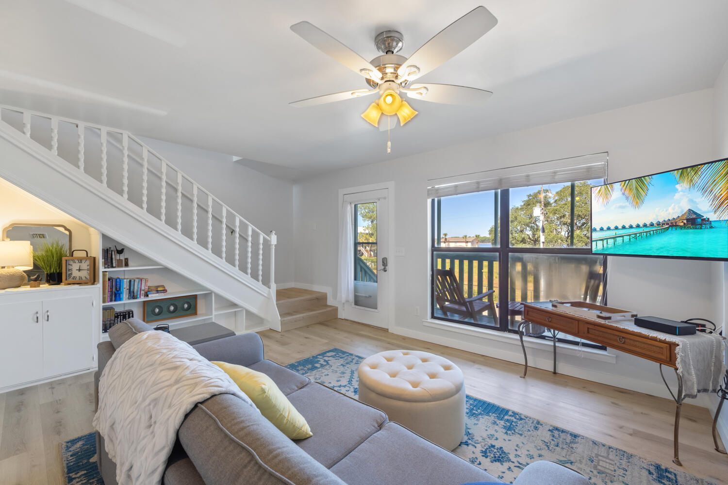 145 Cain Road Panama City Beach, FL 32413 - Photo 33 of 60 a living room with furniture and a table