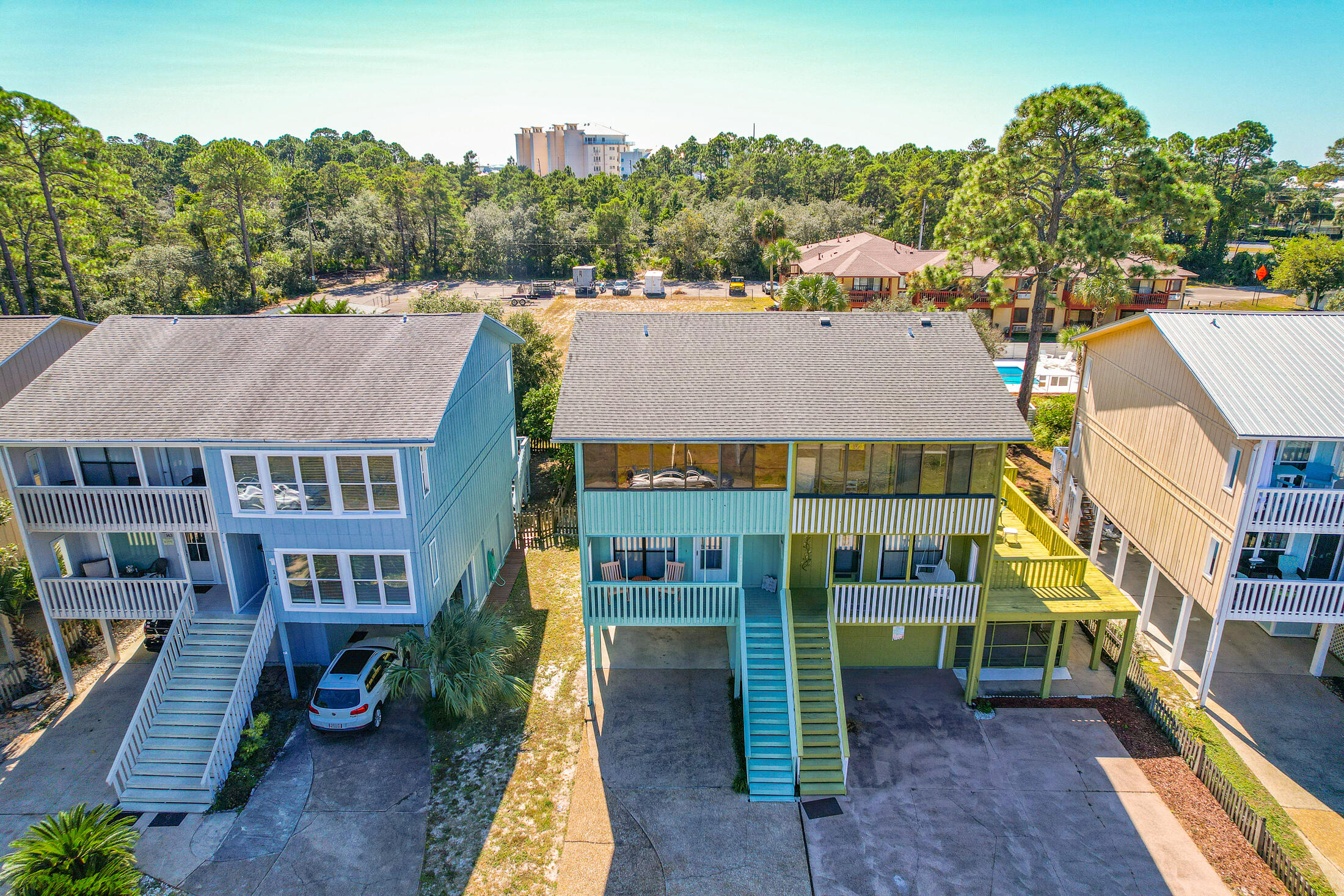 145 Cain Road Panama City Beach, FL 32413 - Photo 40 of 60 an aerial view of multiple houses with a yard