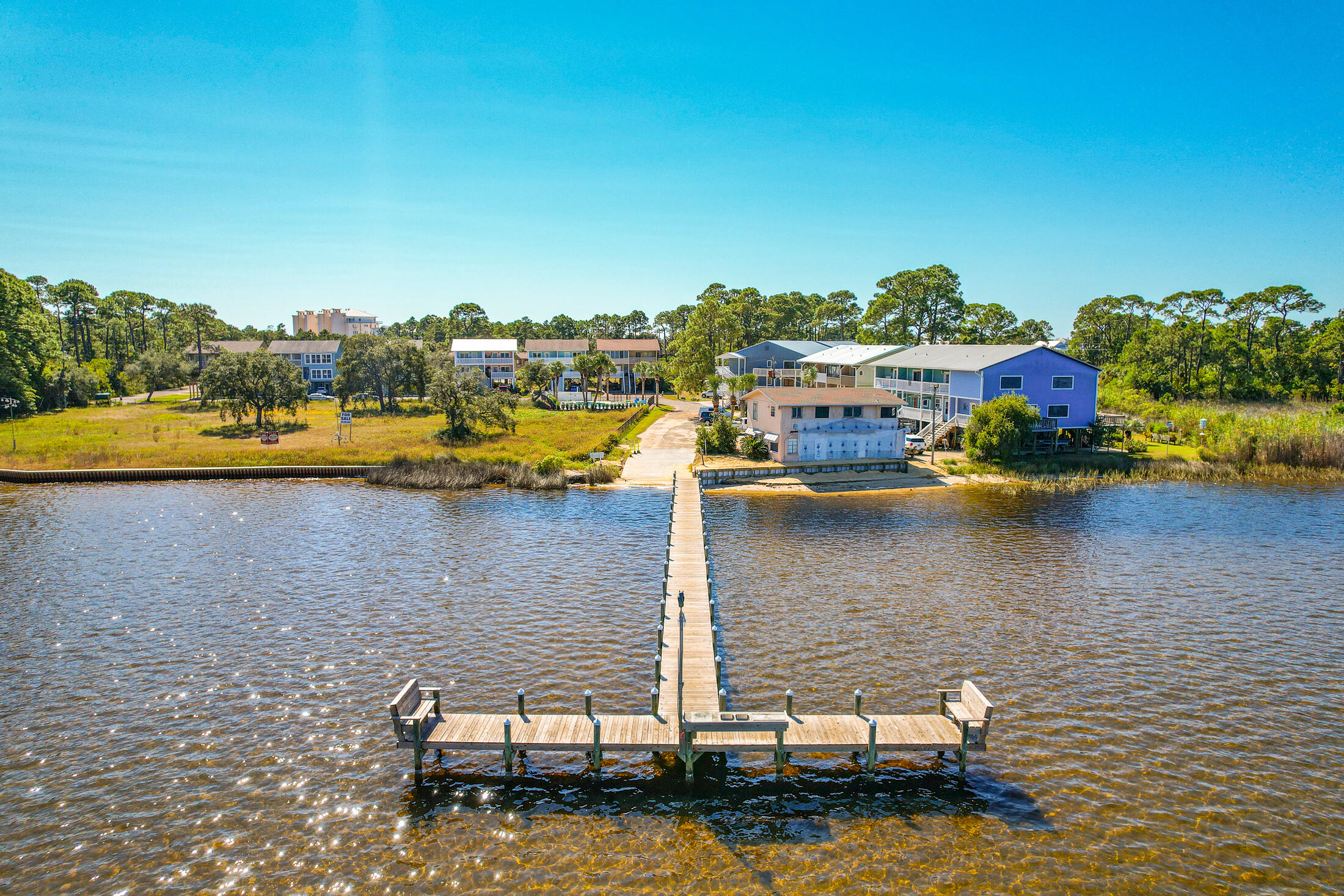 145 Cain Road Panama City Beach, FL 32413 - Photo 57 of 60 a view of a lake with houses