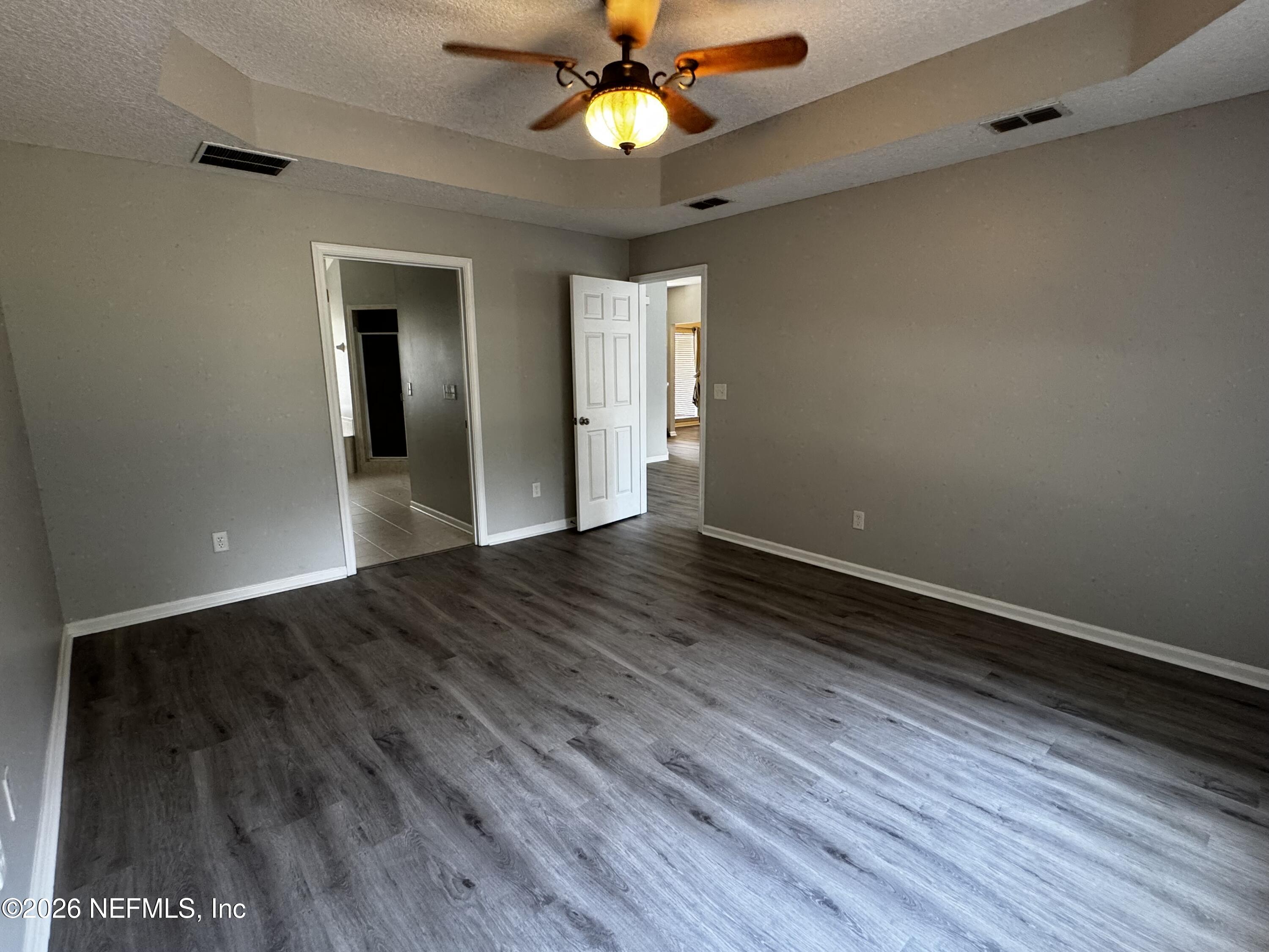 16255 Shellcracker Road Jacksonville, FL 32226 - Photo 11 of 40 wooden floor in an empty room with a window