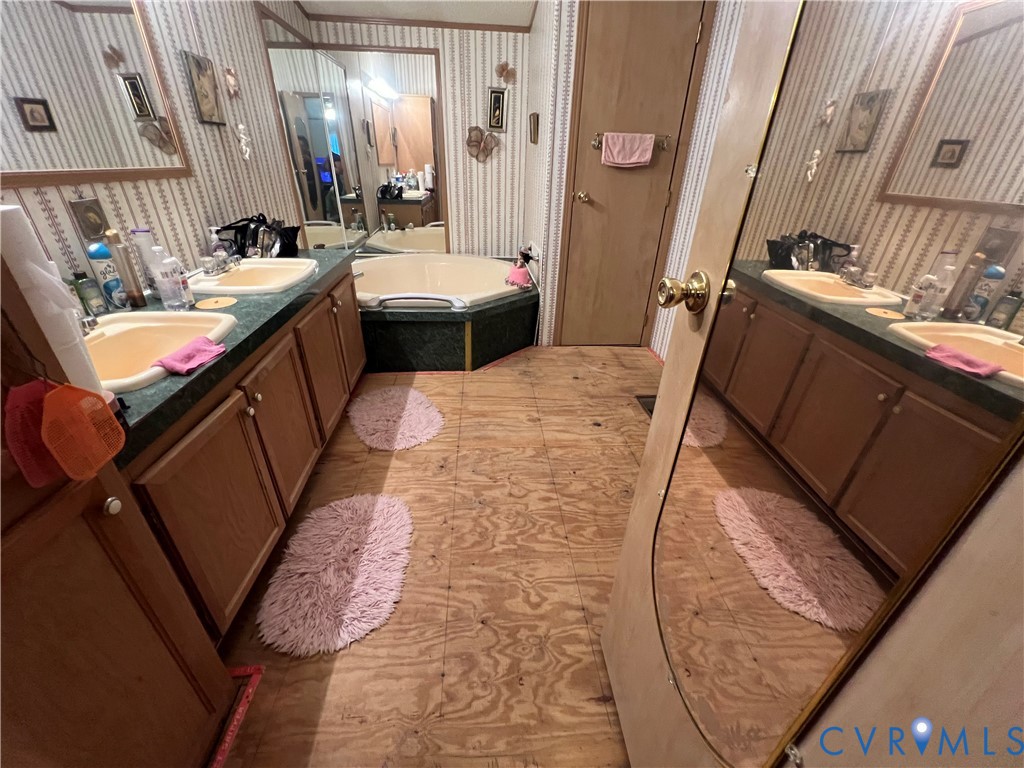 238 Samford Street Alberta, VA 23821 - Photo 8 of 10 Bathroom with a garden tub, wallpapered walls, and