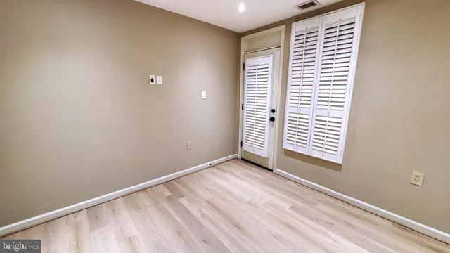 a view of an empty room and window