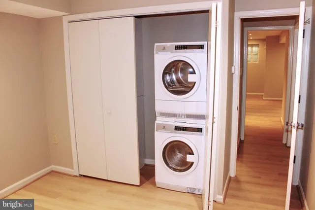 a view of a hallway with washer and dryer