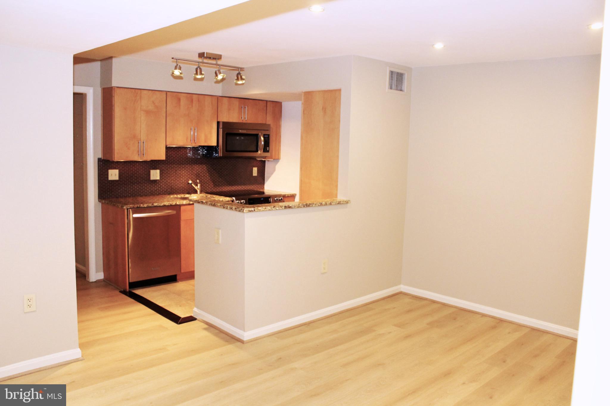 1010 22nd Street Northwest, Unit B Washington, DC 20037 - Photo 4 of 28 Living Room & Kitchen