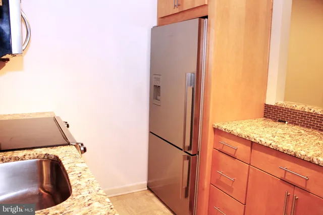 a view of a kitchen from the hallway