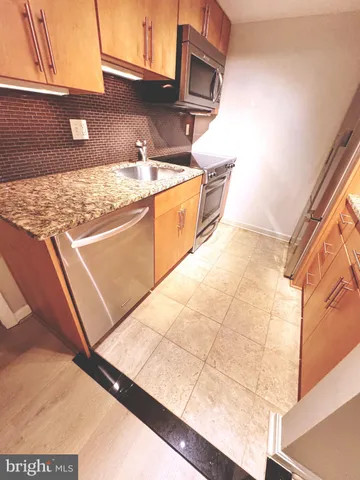 a view of a bathroom from a corridor