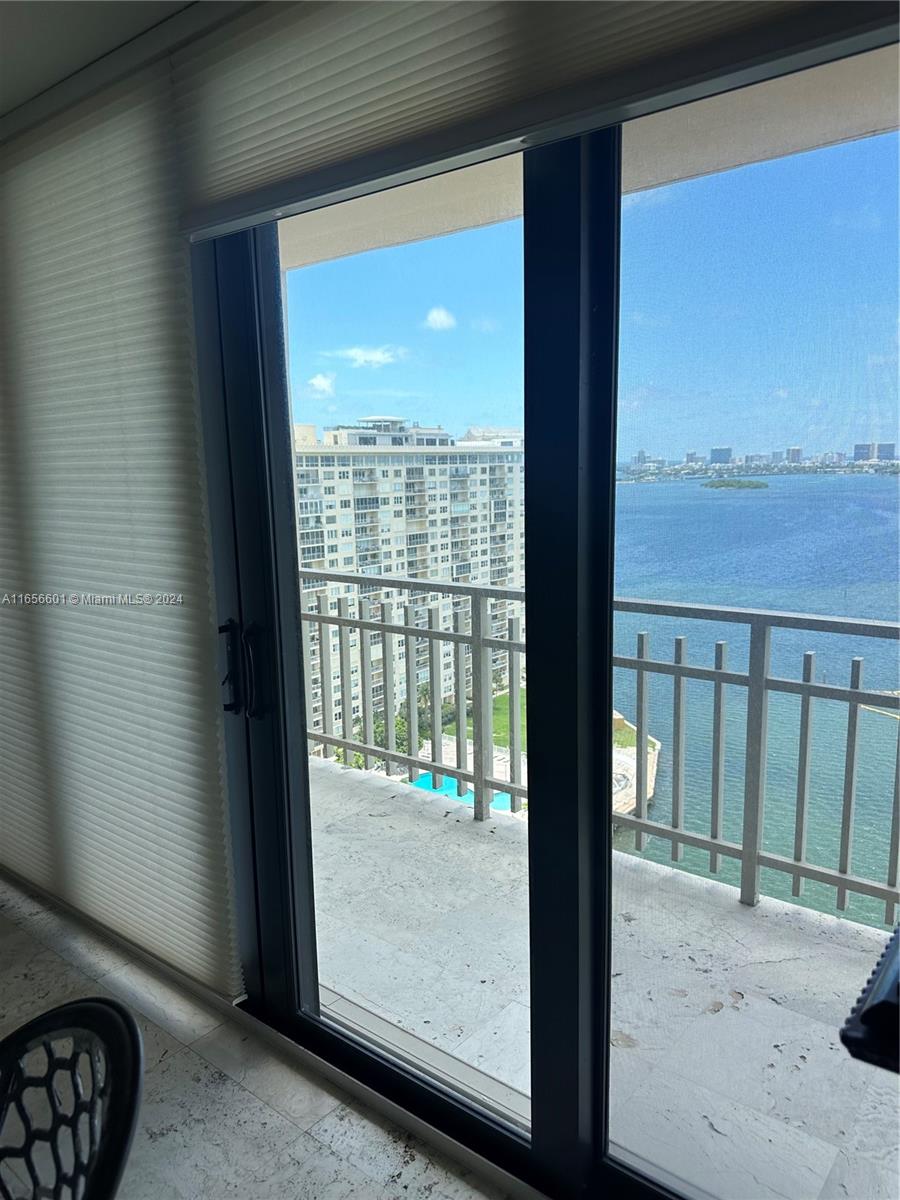 11113 Biscayne Boulevard, Unit 2057 Miami, FL 33181 - Photo 3 of 5 a view of balcony with floor to ceiling window