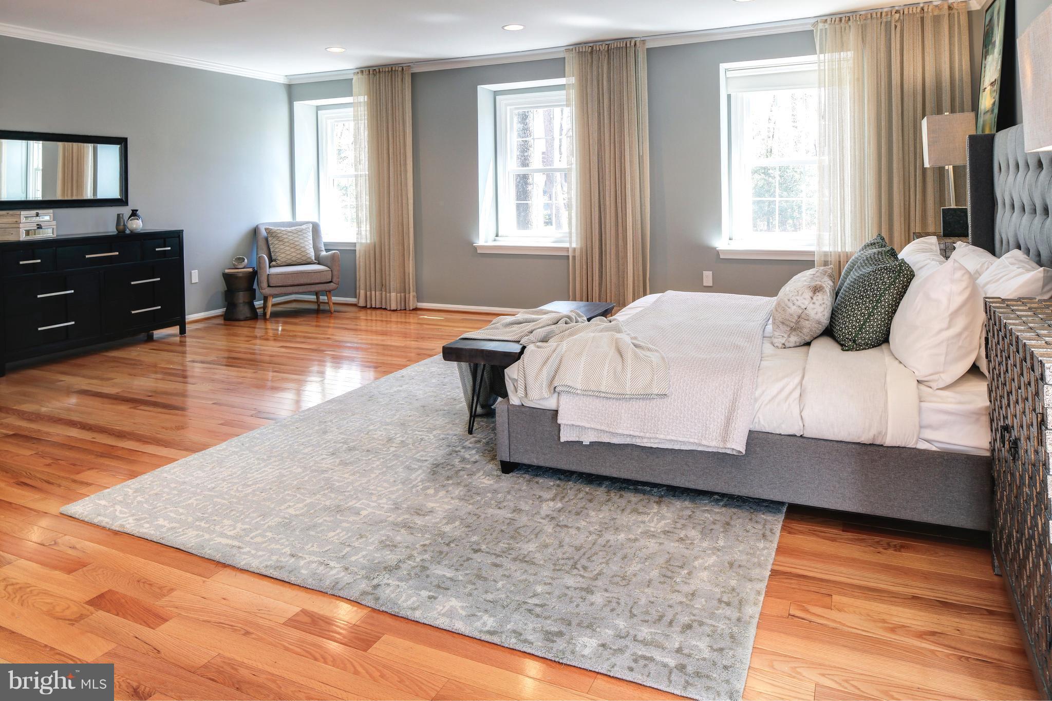 1688 Coventry Place Annapolis, MD 21401 - Photo 18 of 30 a bedroom with a bed and wooden floor