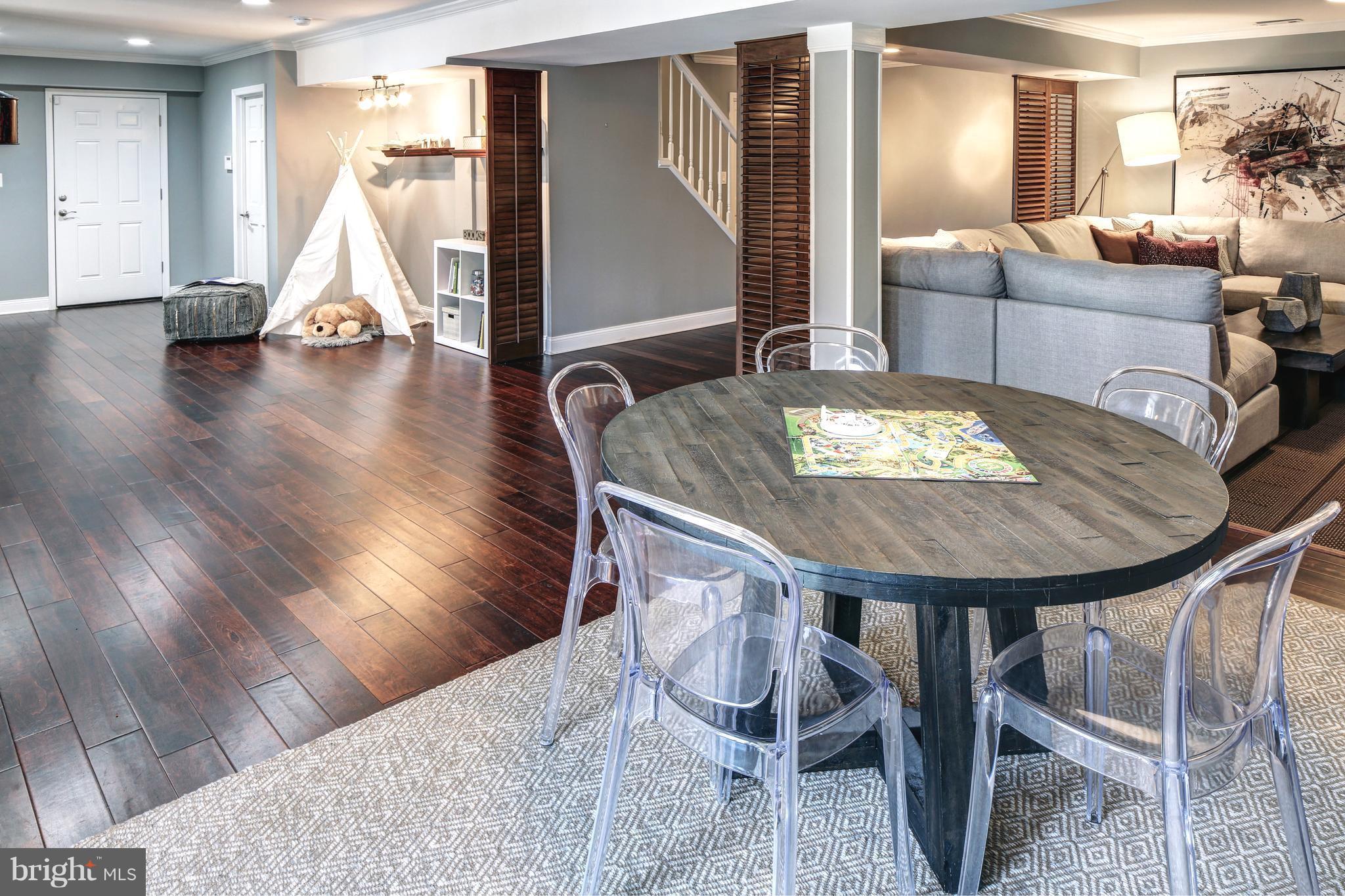 1688 Coventry Place Annapolis, MD 21401 - Photo 26 of 30 a living room with furniture and wooden floor