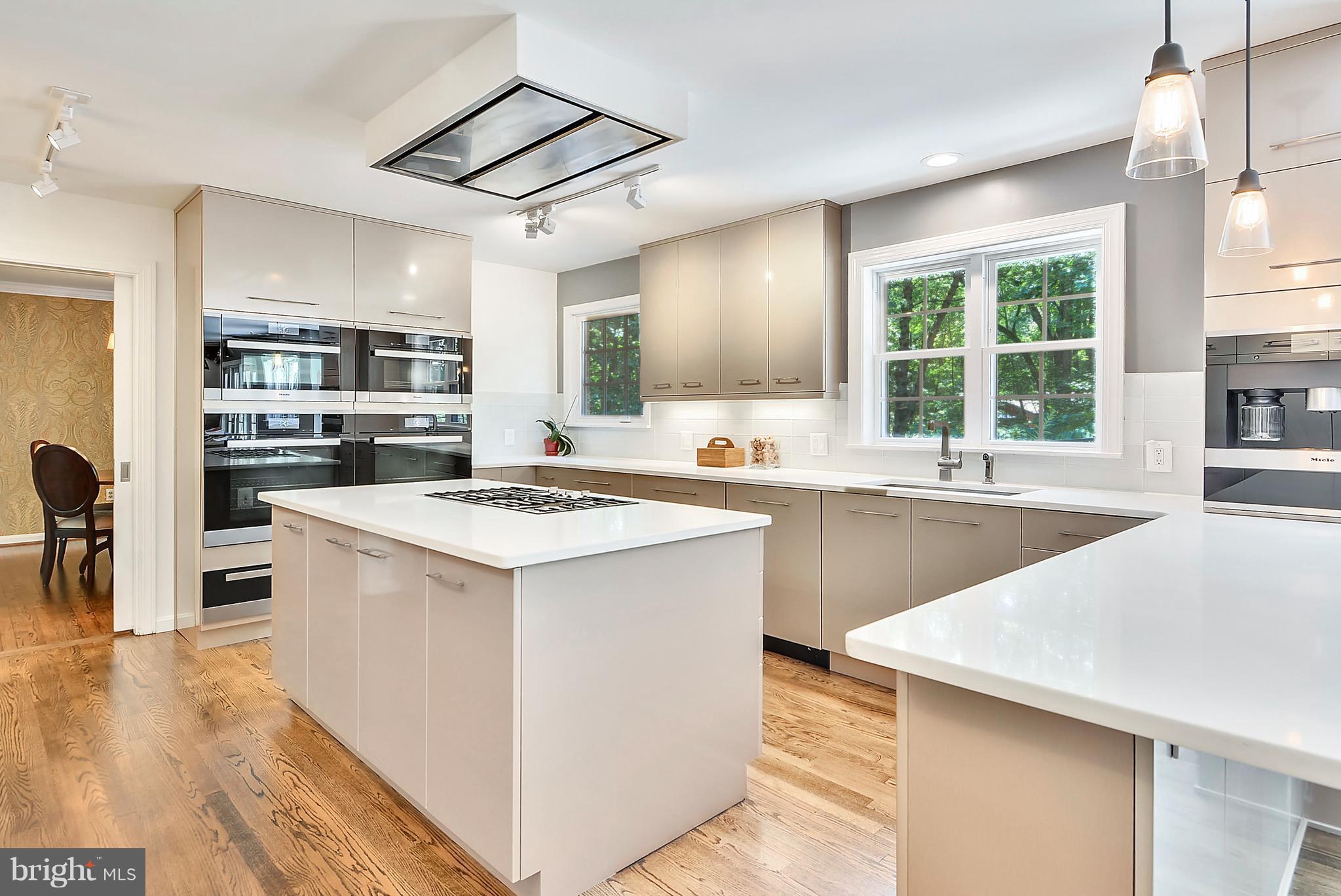 1688 Coventry Place Annapolis, MD 21401 - Photo 8 of 30 a kitchen with stainless steel appliances kitchen island granite countertop a sink and a stove