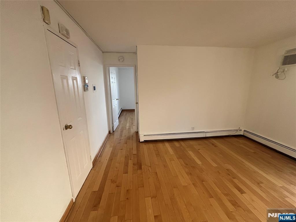 201 12th Street, Unit 6 Palisades Park, NJ 07650 - Photo 11 of 19 a view of a room with wooden floor and staircase