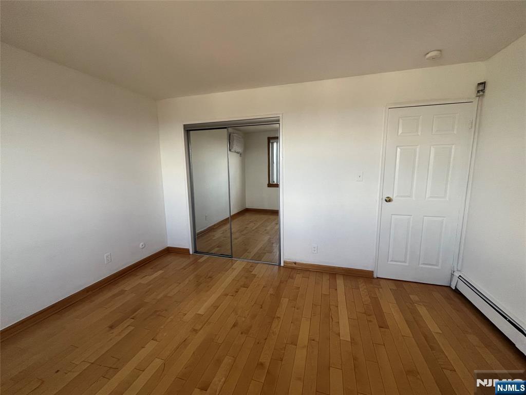201 12th Street, Unit 6 Palisades Park, NJ 07650 - Photo 13 of 19 wooden floor in an empty room