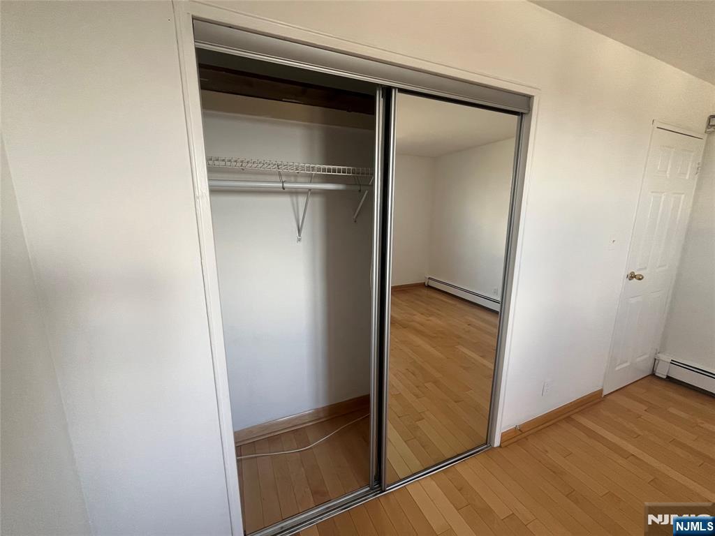 201 12th Street, Unit 6 Palisades Park, NJ 07650 - Photo 14 of 19 a bathroom with a glass door