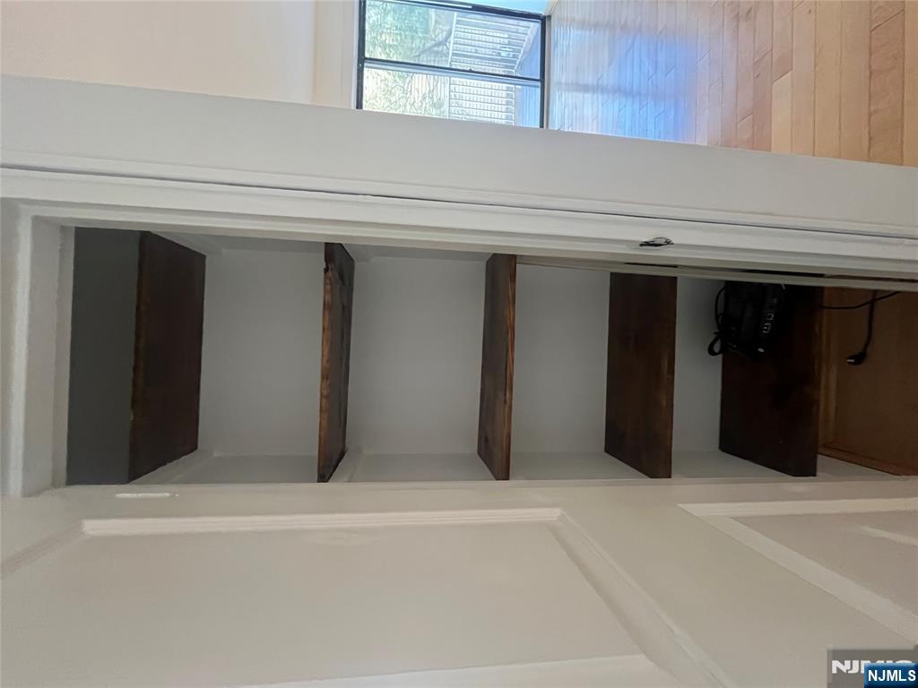 201 12th Street, Unit 6 Palisades Park, NJ 07650 - Photo 16 of 19 a room with a staircase and a fireplace