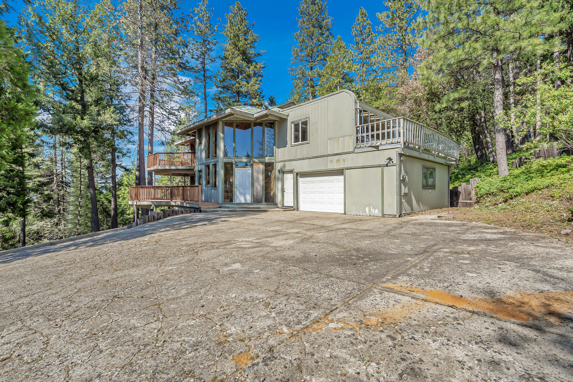 15368 Star Flower Road Oak Run, CA 96069 - Photo 4 of 63 a view of a house with a large tree