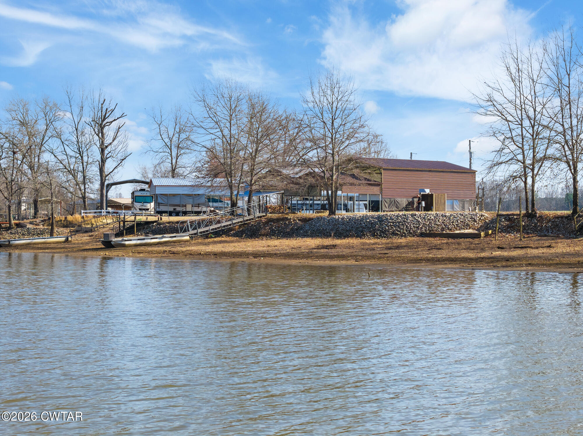 267 Dd Cove Decaturville, TN 38329 - Photo 12 of 60 a view of a lake with houses