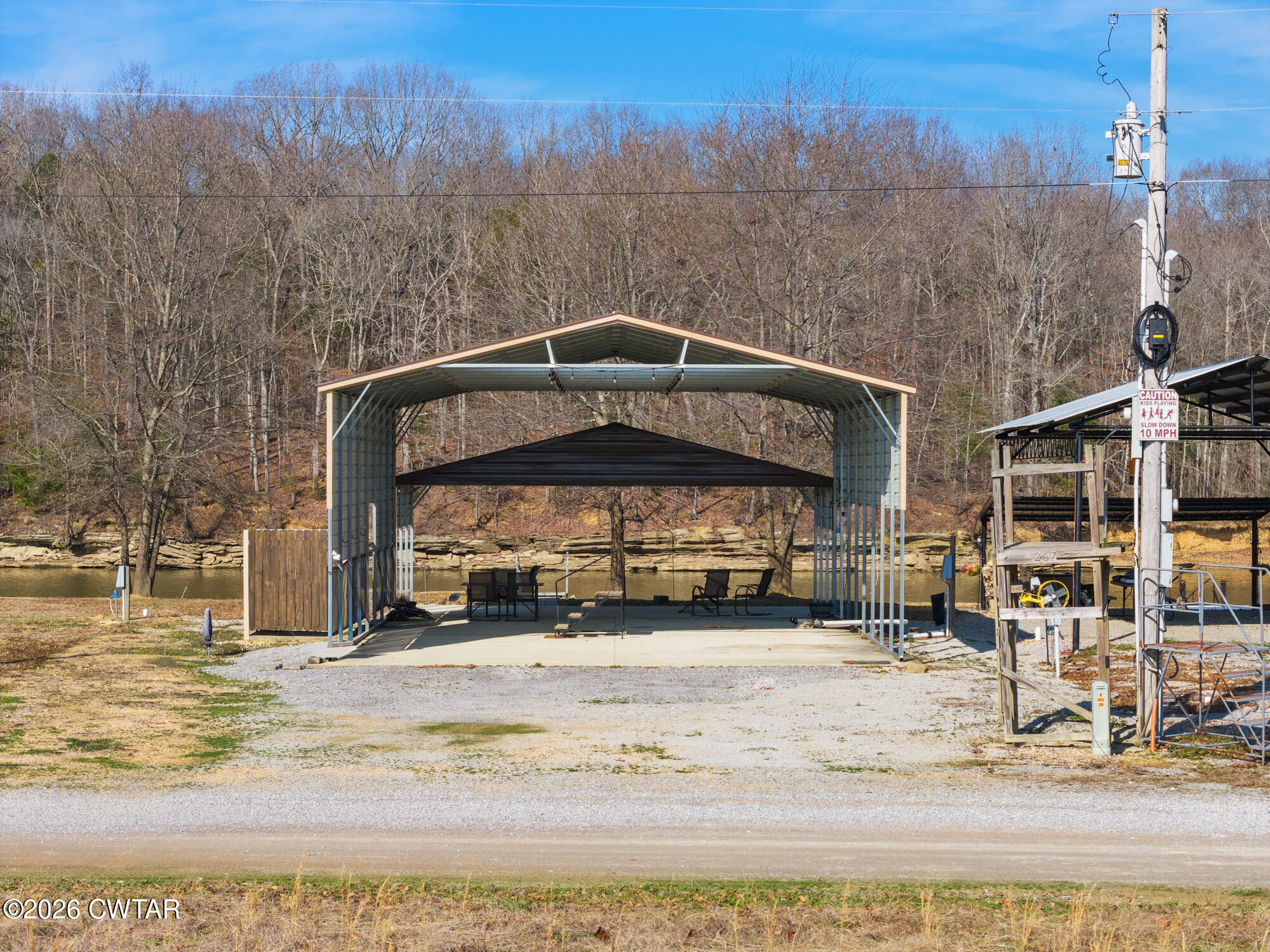 267 Dd Cove Decaturville, TN 38329 - Photo 14 of 60 a view of a building with a yard