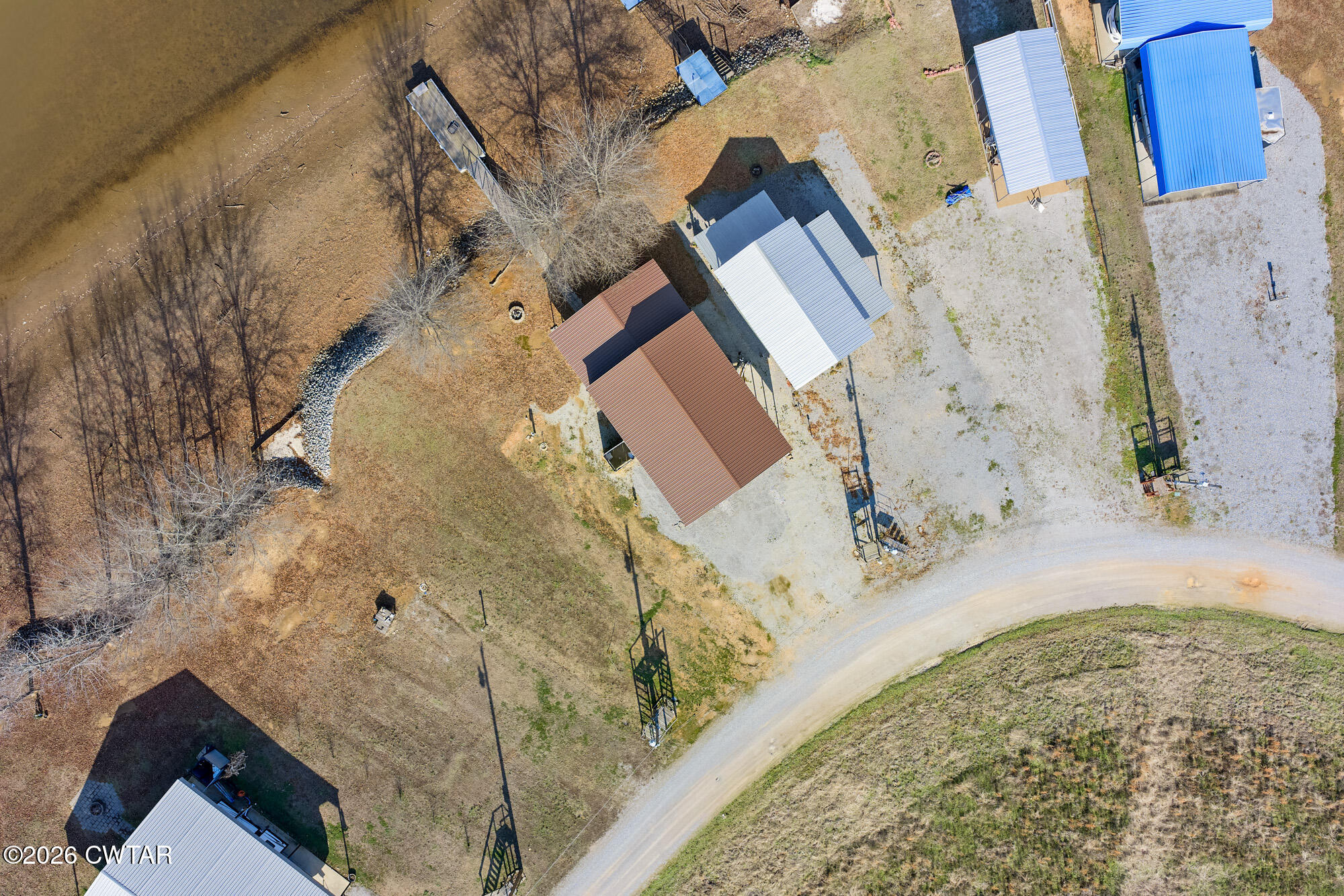 267 Dd Cove Decaturville, TN 38329 - Photo 25 of 60 an aerial view of a house with a yard