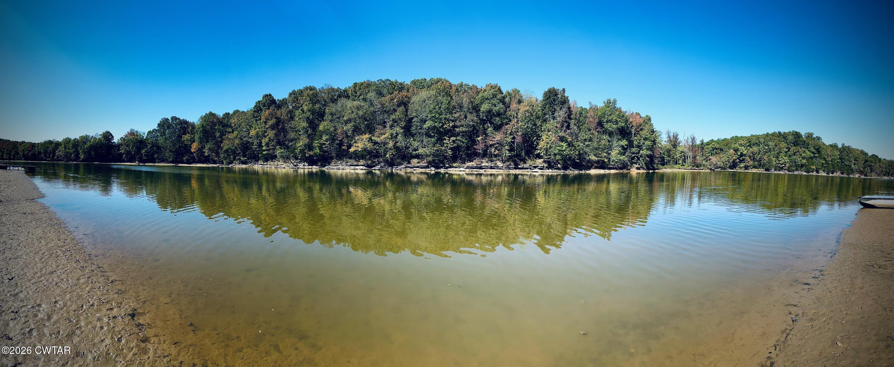 267 Dd Cove Decaturville, TN 38329 - Photo 38 of 60 a view of a lake with houses in the back