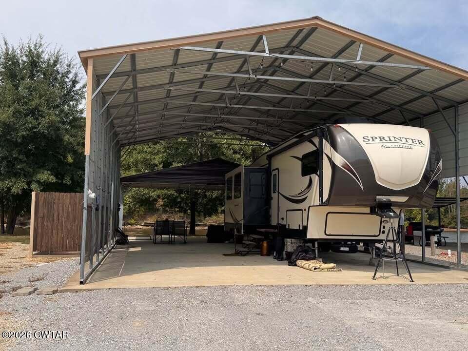 267 Dd Cove Decaturville, TN 38329 - Photo 39 of 60 a front view of a house with a garden