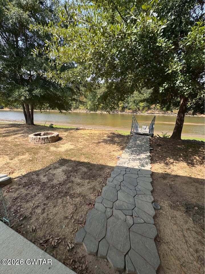 267 Dd Cove Decaturville, TN 38329 - Photo 42 of 60 a view of a yard with wooden fence