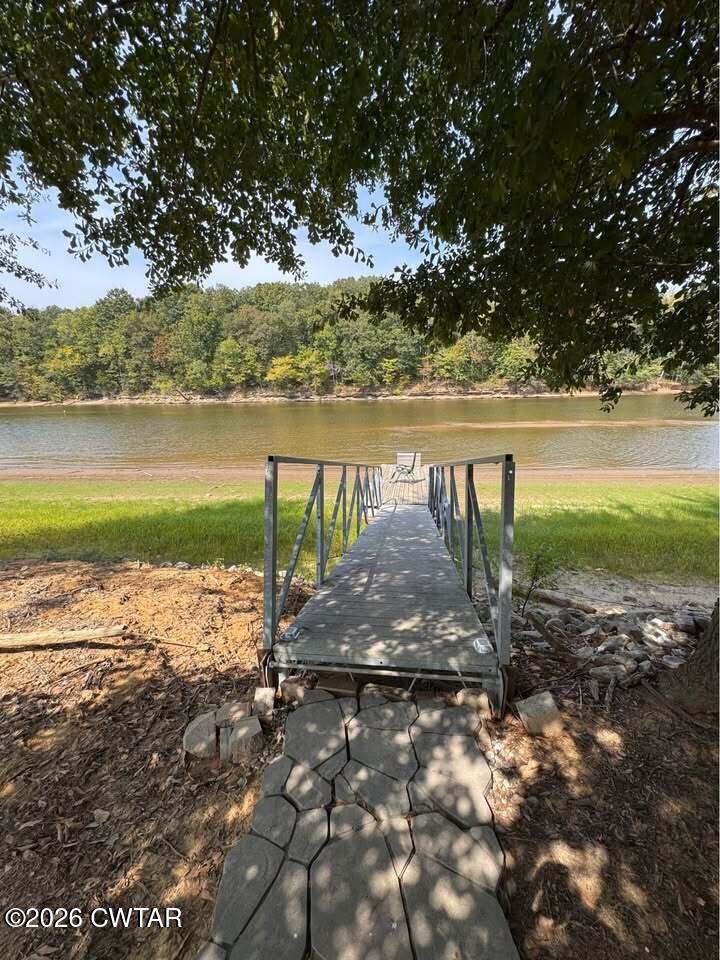 267 Dd Cove Decaturville, TN 38329 - Photo 43 of 60 a view of a lake with a table and chairs