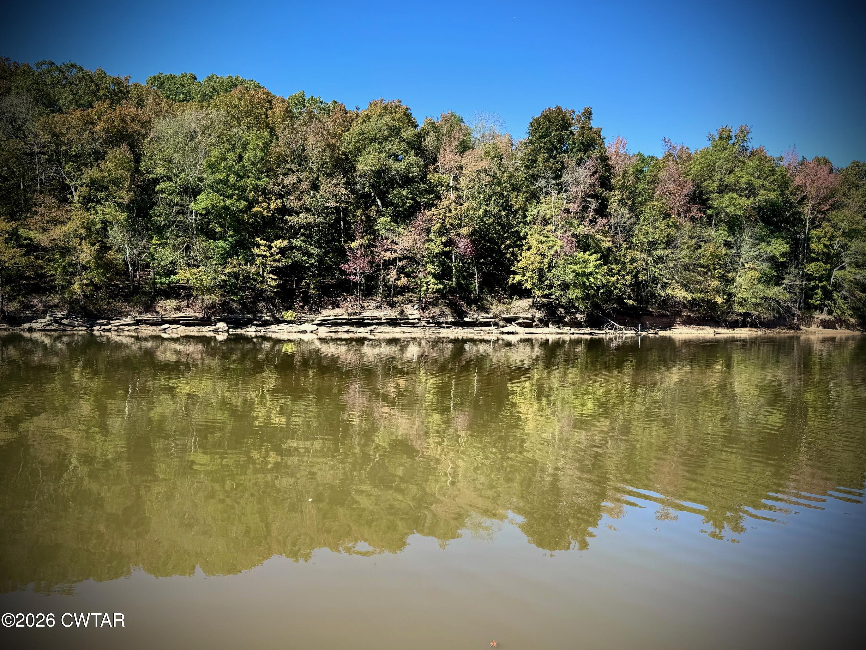 267 Dd Cove Decaturville, TN 38329 - Photo 45 of 60 a view of a lake with a mountain in the background