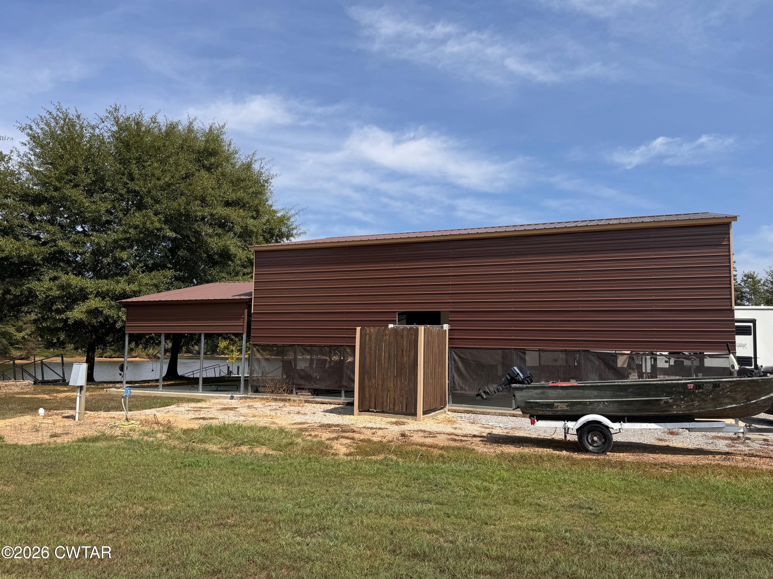 267 Dd Cove Decaturville, TN 38329 - Photo 47 of 60 a view of a house with swimming pool and sitting area