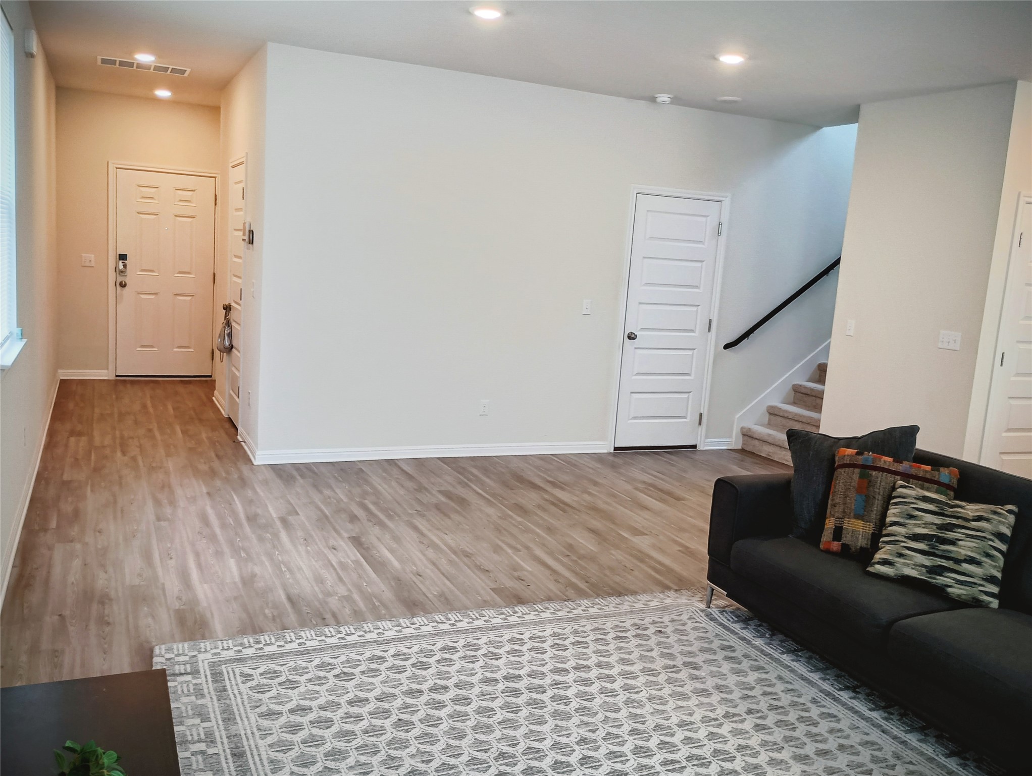 10615 Ridan Way Buda, TX 78610 - Photo 10 of 21 Living room featuring light wood-style floors and recessed lighting