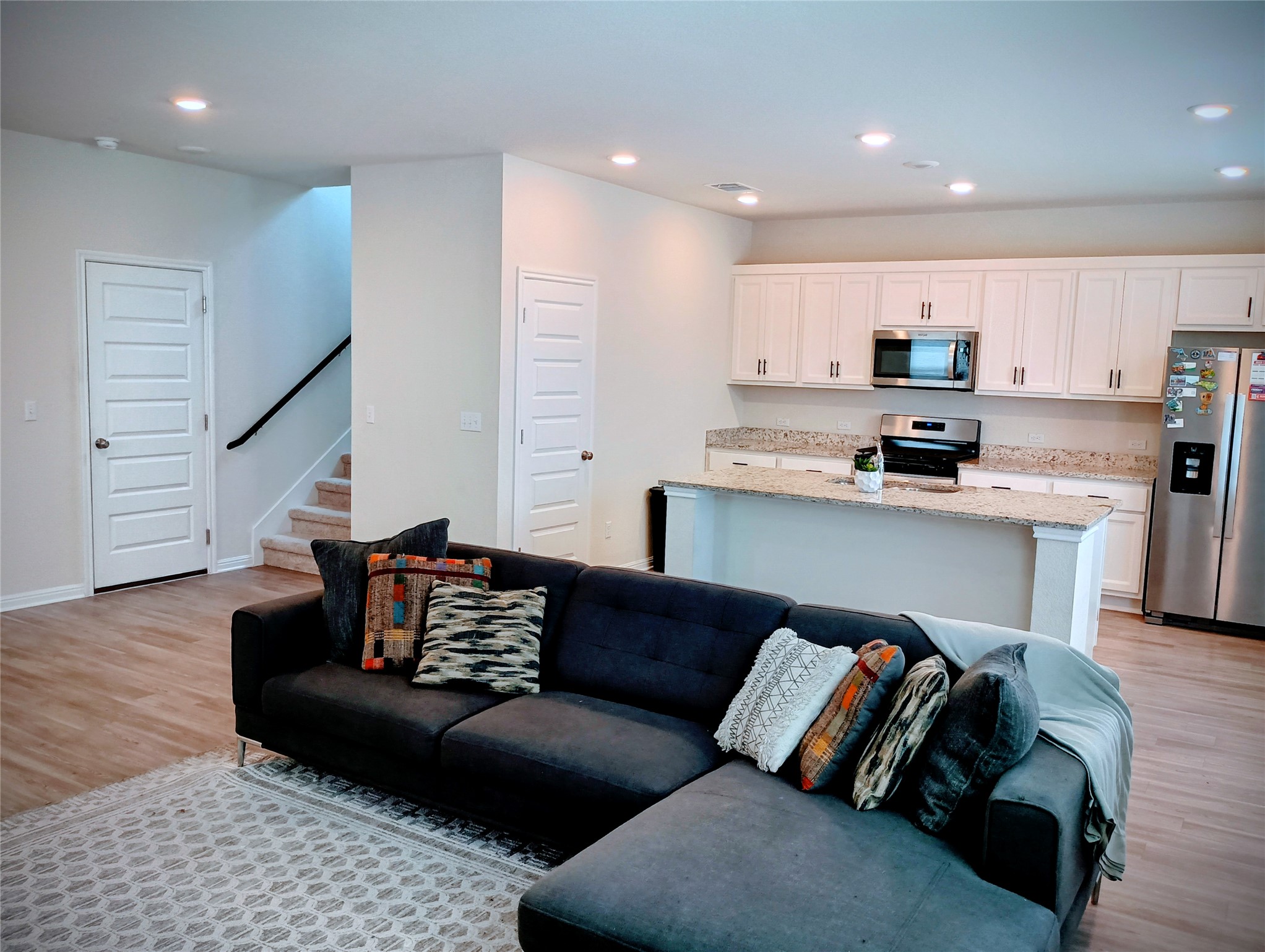 10615 Ridan Way Buda, TX 78610 - Photo 9 of 21 Living room with light wood finished floors and recessed lighting