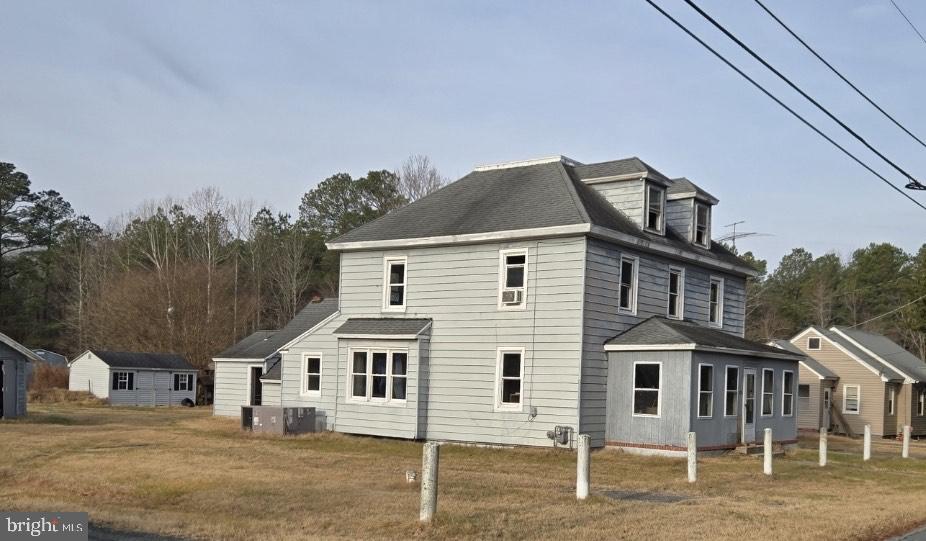 820-824 Shad Point Road Salisbury, MD 21801 - Photo 2 of 7 a front view of a house with a porch