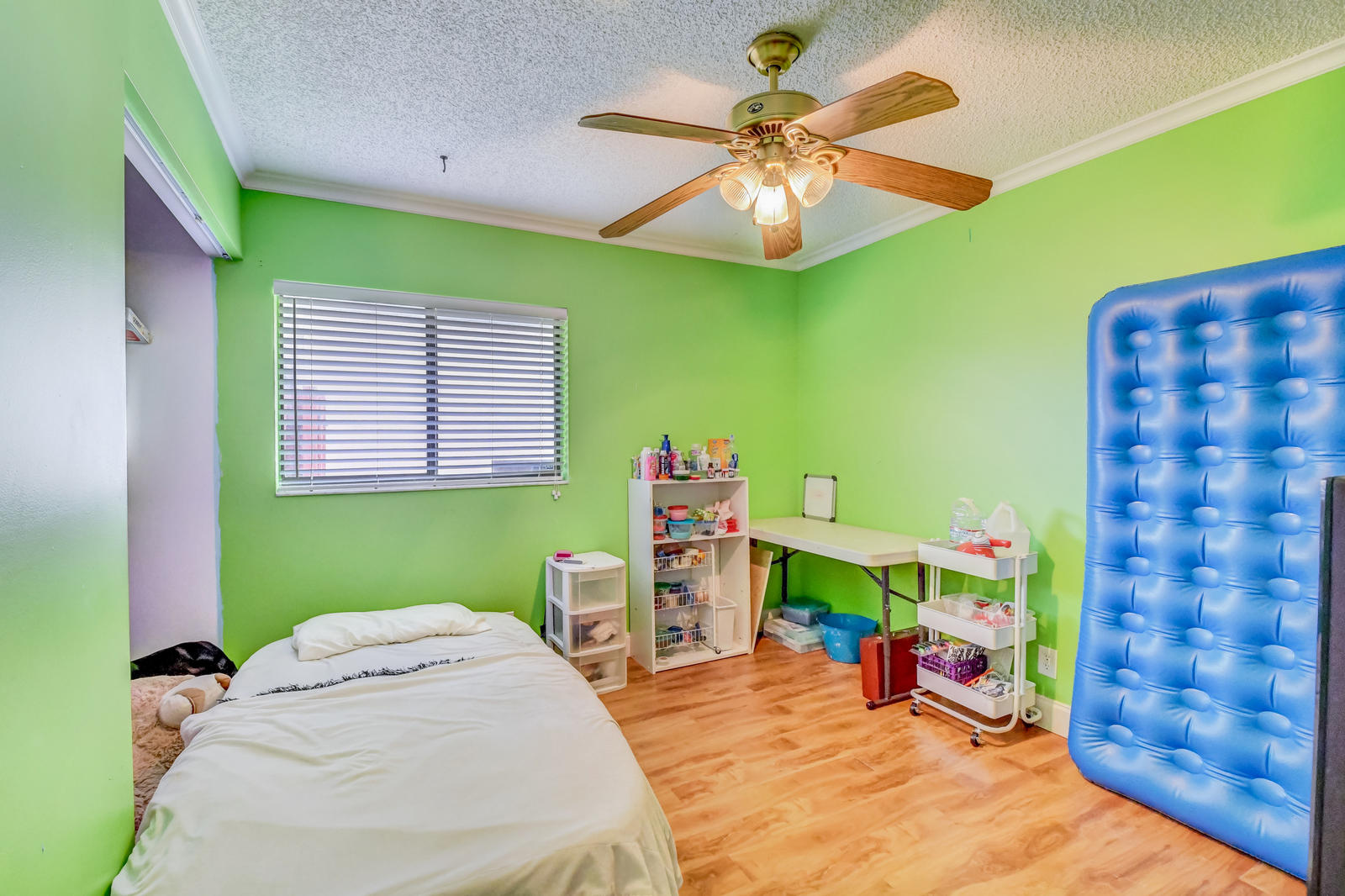 11682 Springflower Place Boca Raton, FL 33428 - Photo 30 of 66 a bedroom with a bed and a chandelier