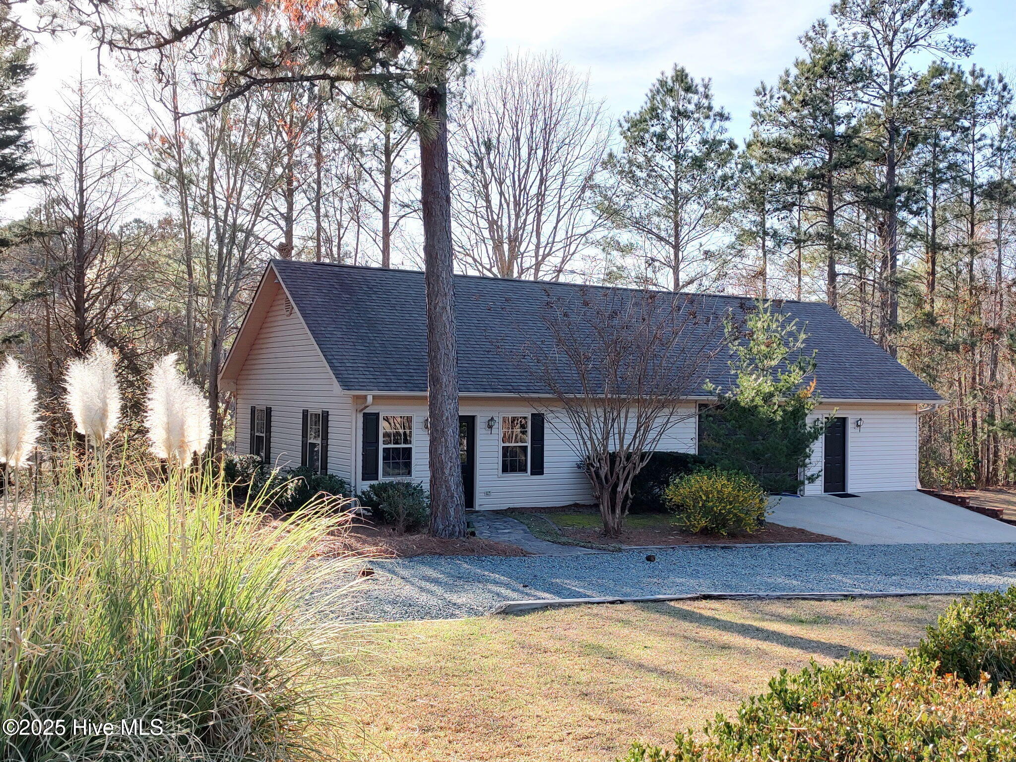 1336 McCaskill Road Carthage, NC 28327 - Photo 12 of 88 1,300 sq ft climate-controlled detached building with dedicated HVAC and electrical panel ready for office/fitness/entertainment area - pool table to convey Building includes additional garage parking for 3 cars + UTV/Golf Cart storage, built-in bench tops and integrated compressor airlines