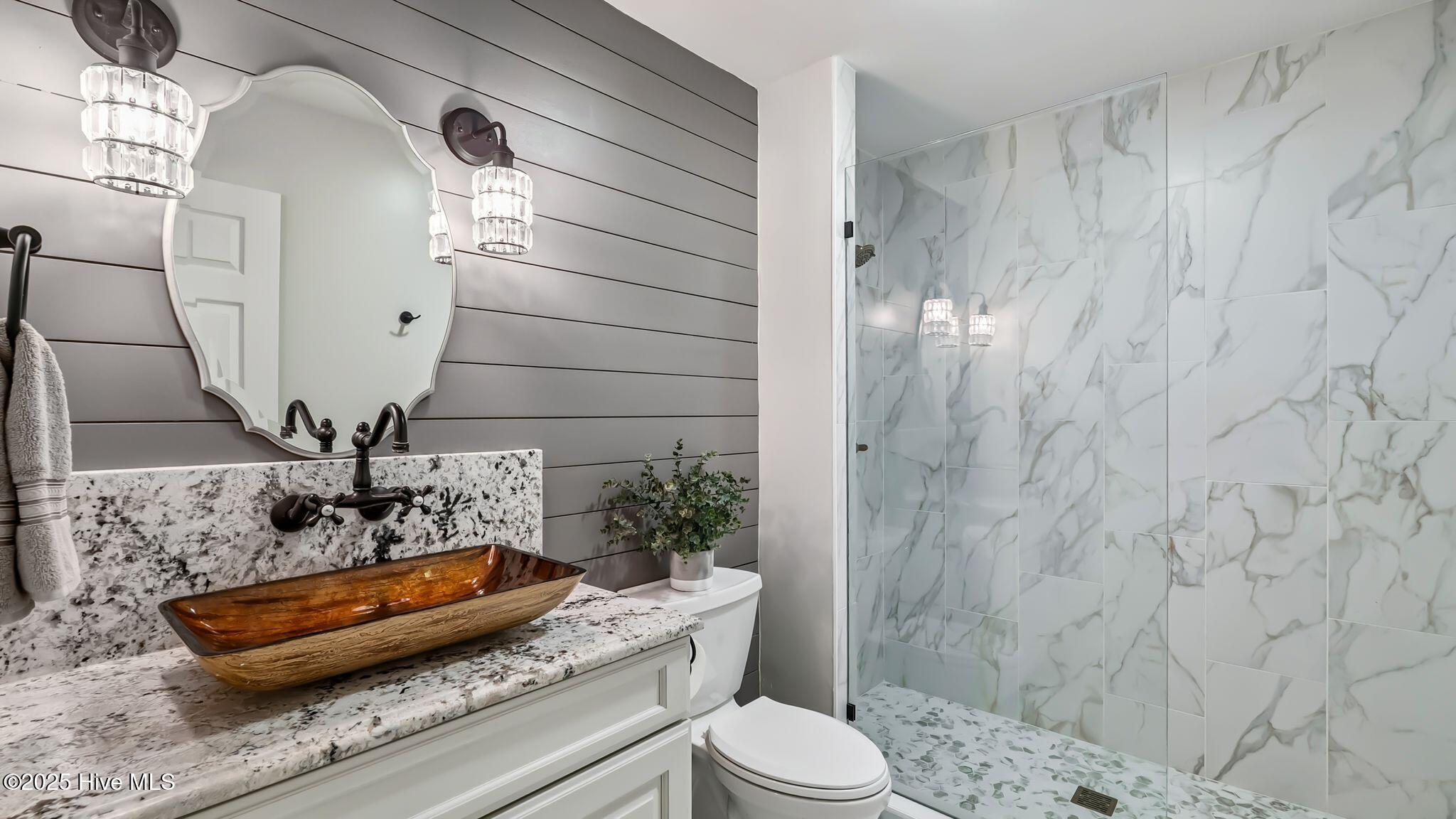 1336 McCaskill Road Carthage, NC 28327 - Photo 43 of 88 Main level guest bathroom luxuriously renovated with low to zero-entry custom shower