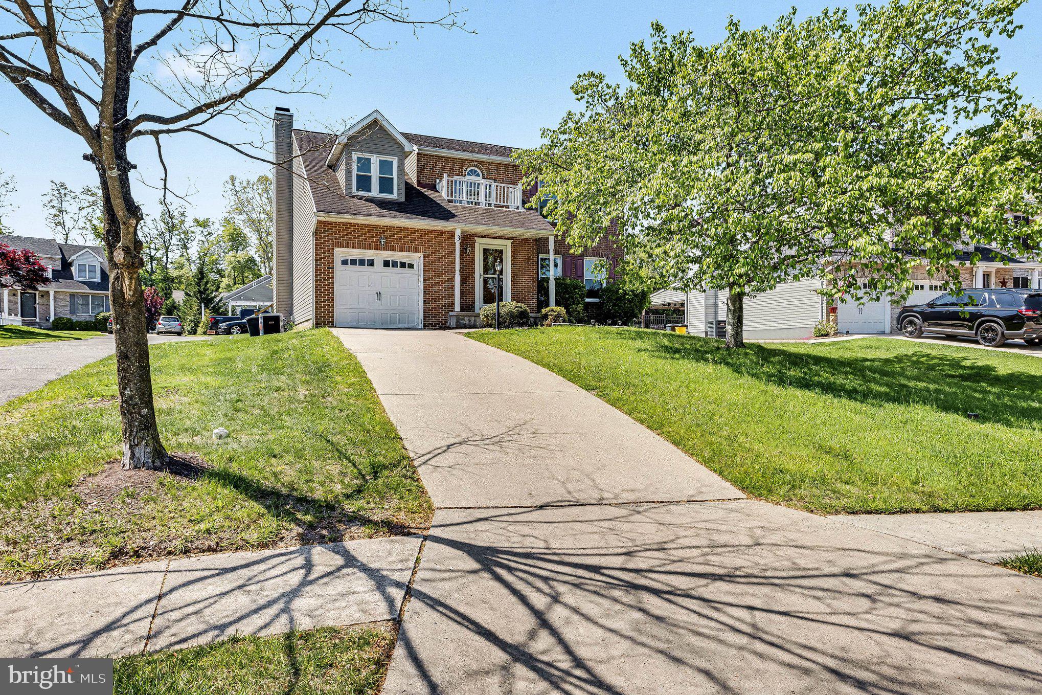 3 Perry Ridge Court Baltimore, MD 21237 - Photo 2 of 31 Charming home with lush green surroundings.