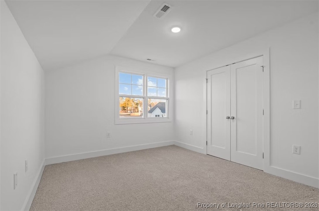 9806 Rockfish Road Raeford, NC 28376 - Photo 12 of 33 a view of an empty room with window and closet area