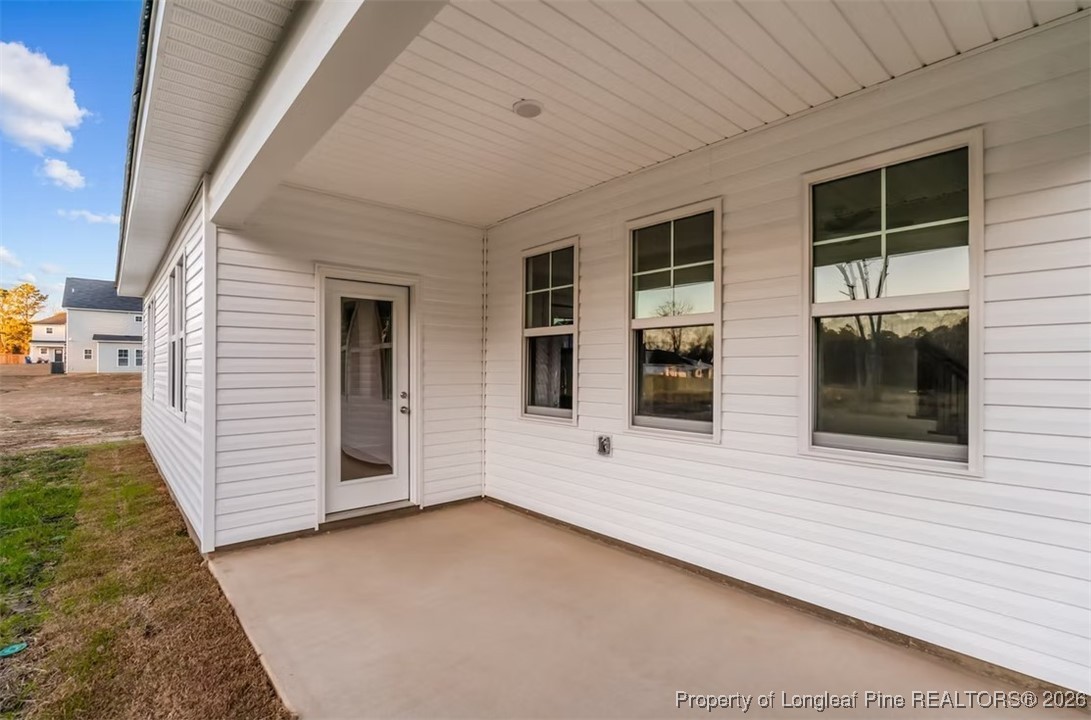 9806 Rockfish Road Raeford, NC 28376 - Photo 16 of 33 a view of front door and yard