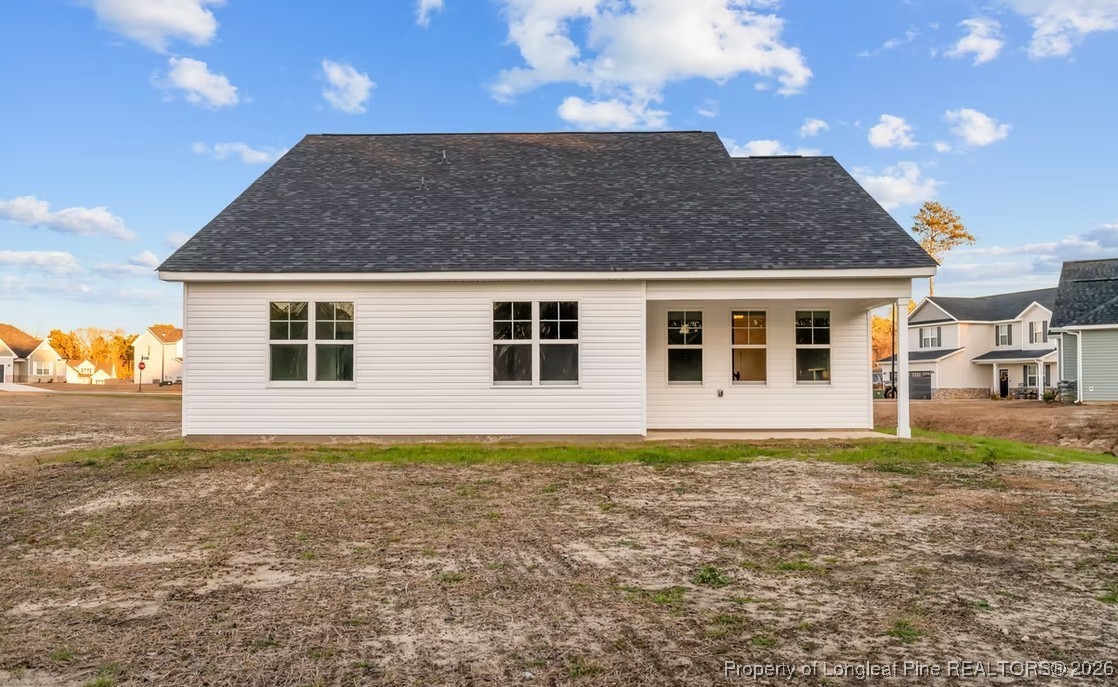 9806 Rockfish Road Raeford, NC 28376 - Photo 17 of 33 a house view with a outdoor space