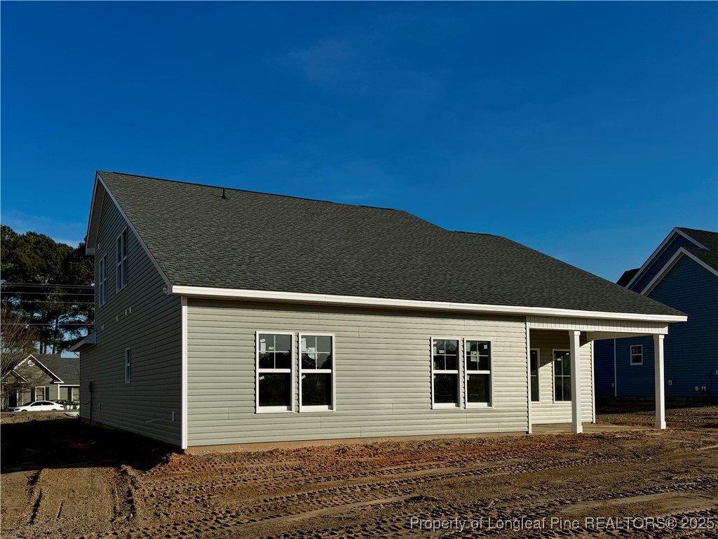 9806 Rockfish Road Raeford, NC 28376 - Photo 30 of 33 a front view of a house with a garden