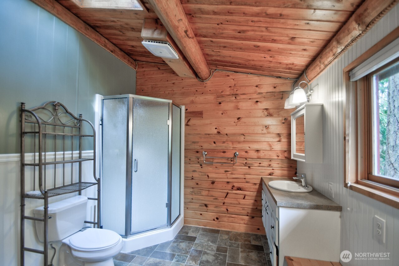18114 Rampart Drive Southeast Yelm, WA 98597 - Photo 17 of 40 a bathroom with a toilet and a shower