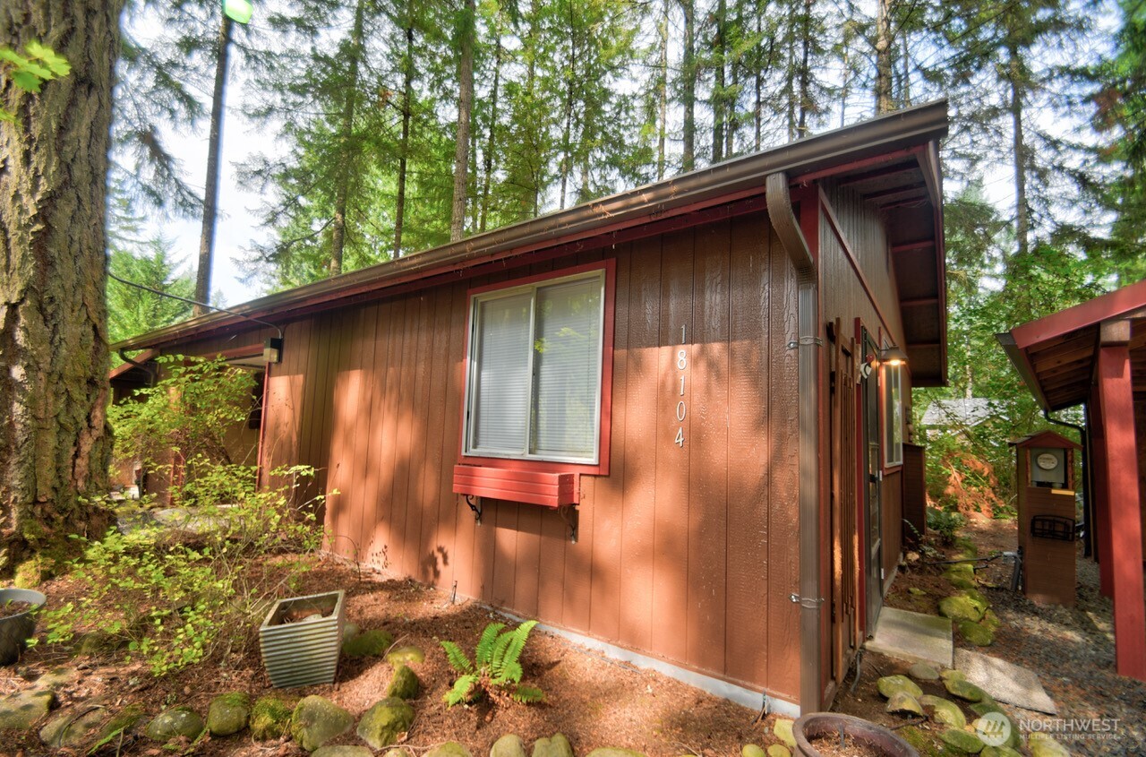 18114 Rampart Drive Southeast Yelm, WA 98597 - Photo 27 of 40 a backyard of a house with table and chairs