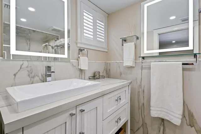 a bathroom with a shower curtain and a shower