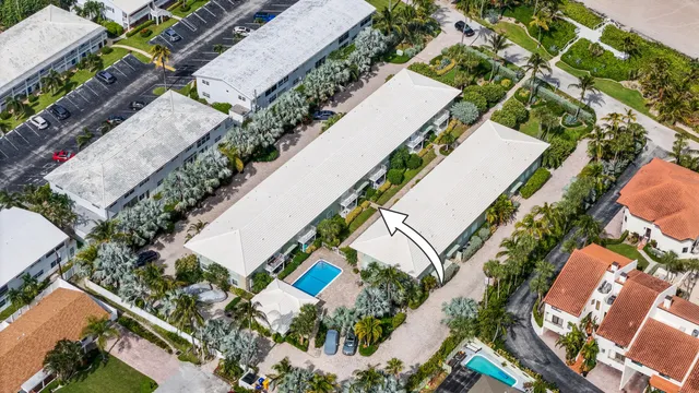 a front view of a building with garden