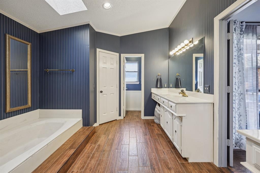 10202 Chisholm Trail Dallas, TX 75243 - Photo 21 of 40 Garden tub, separate shower, dual vanities, and dual closets