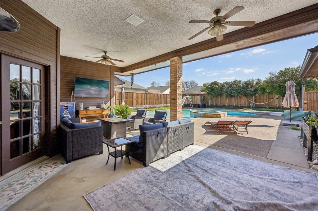 10202 Chisholm Trail Dallas, TX 75243 - Photo 28 of 40 Oversized covered patio with plenty of room for entertaining.