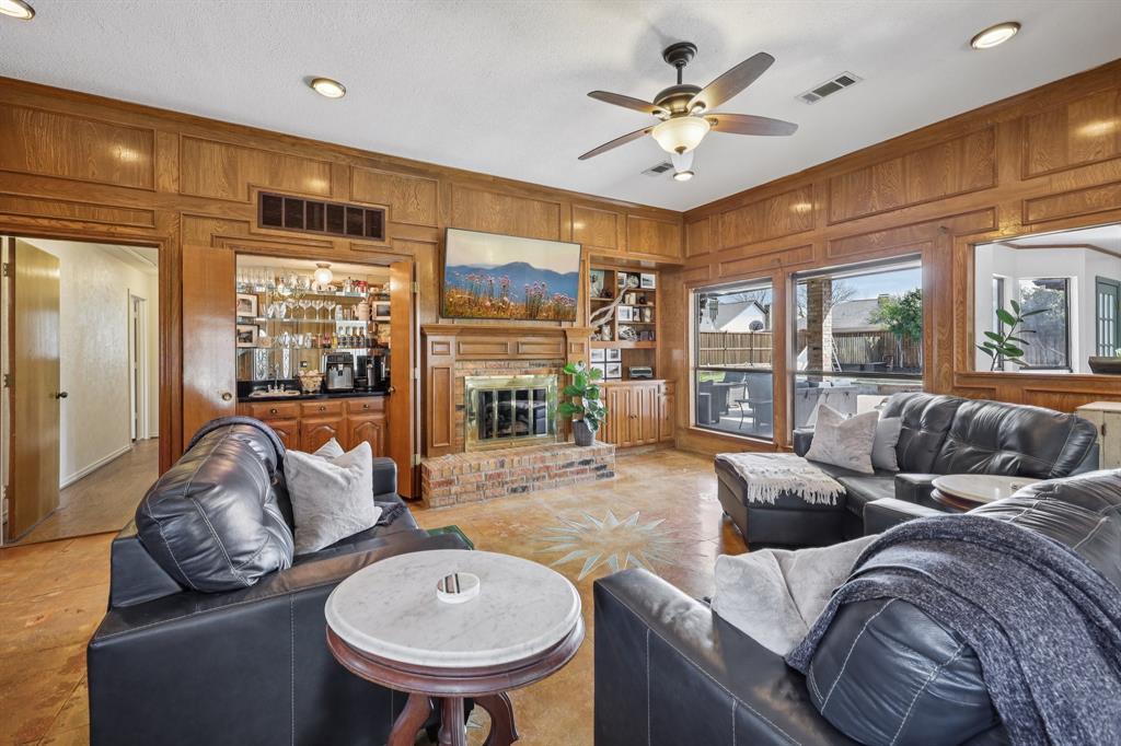 10202 Chisholm Trail Dallas, TX 75243 - Photo 4 of 40 Main living room - concrete floors through out, warm paneling, full view of back yard