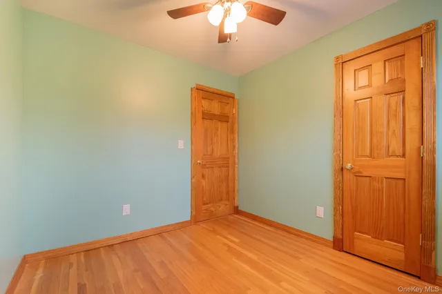 an empty room with closet area
