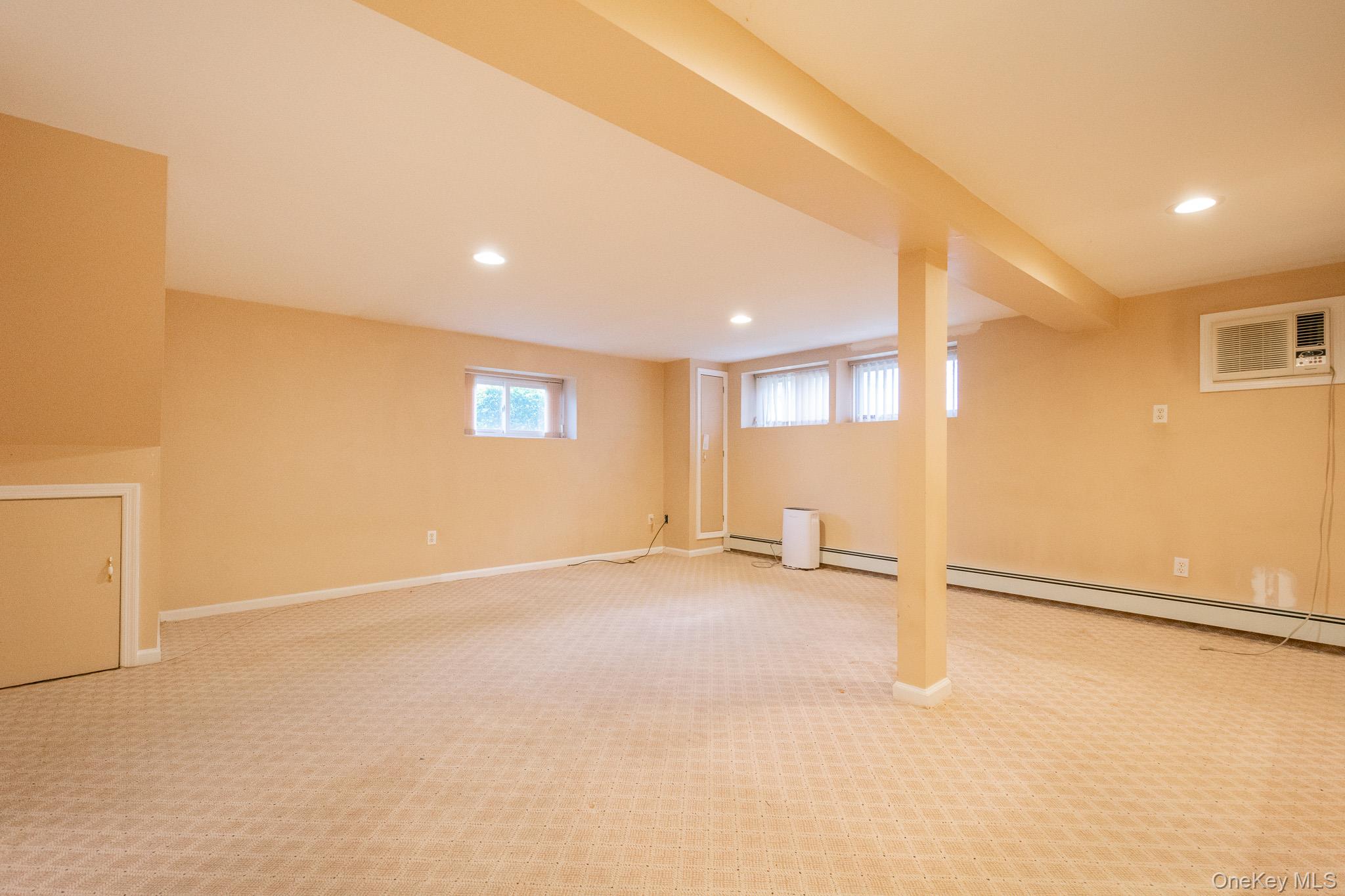 4 Manchester Drive Bethpage, NY 11714 - Photo 17 of 26 an empty room with a empty space and a window